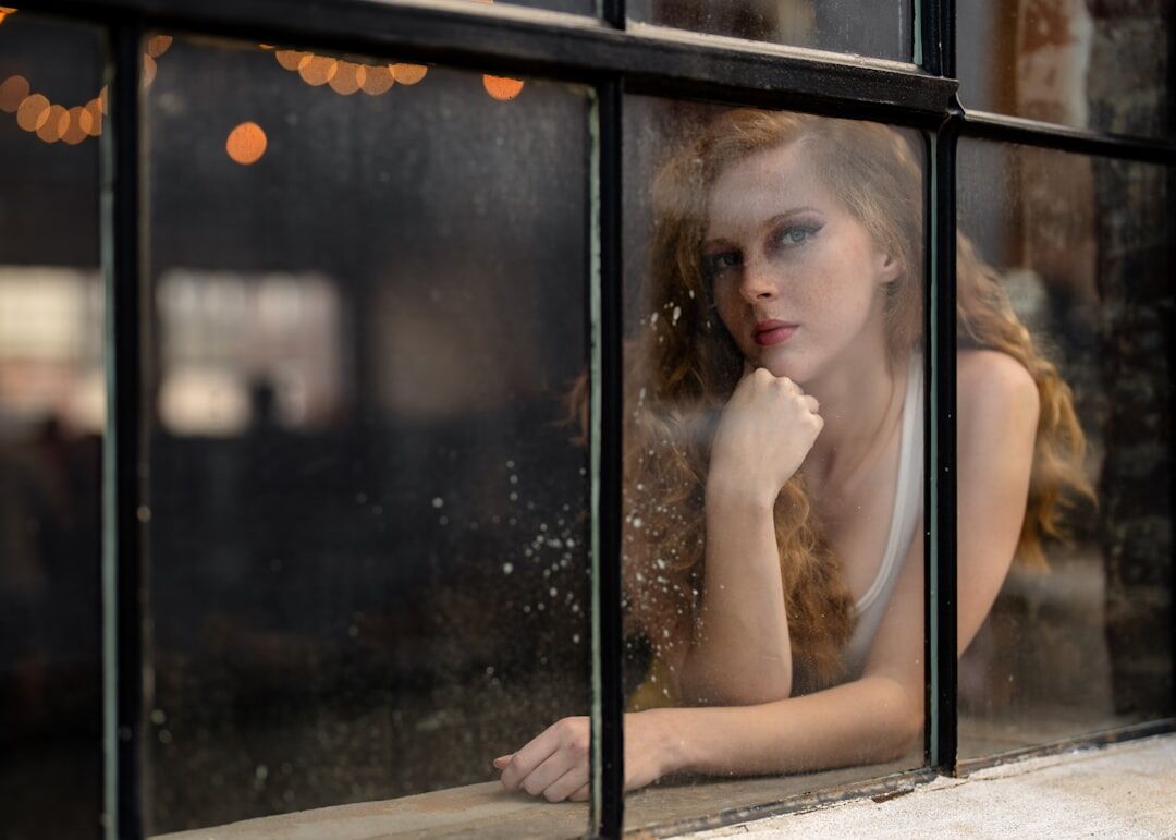 writer looking out window